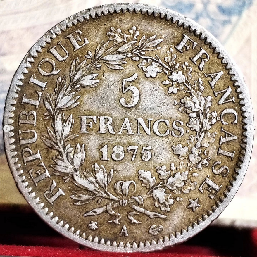 In 1875 during the printing of 5 FRANCS Hercules type coins in the Paris workshop, a punch error on the workshop (letter A) was made on one or more currency corners.  

#coins #oldcoins #frenchhistory #numismatics #francs #france #worldhistory #ancientcoins #worldcoins #HERCULES