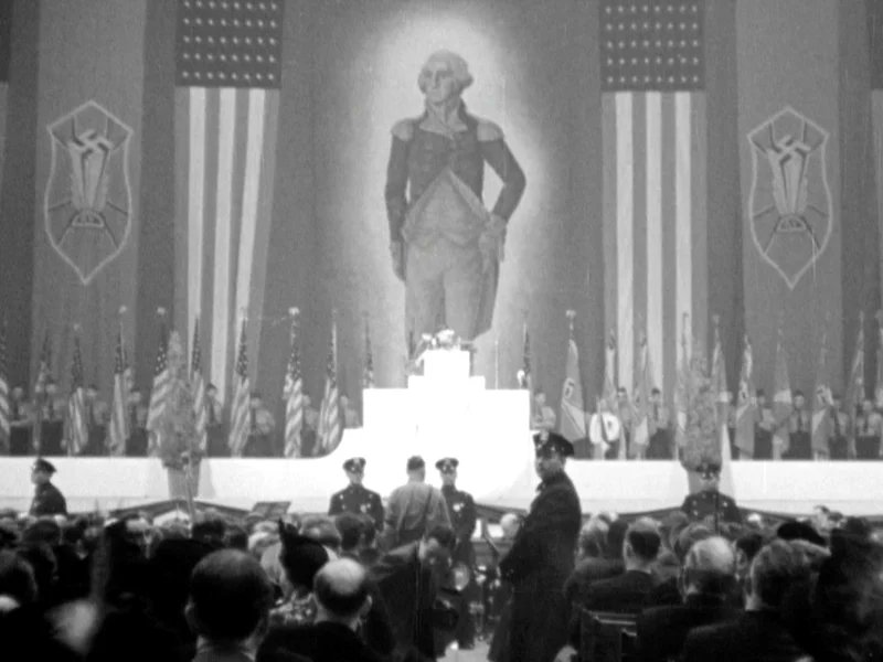 worldartira's tweet photo. @fasc1nate An enormous portrait of George Washington hangs alongside swastika banners and American flags at New York's Madison Square Garden in 1939 during the German American Bund's Pro American Rally. https://t.co/QJJgeP2JkE