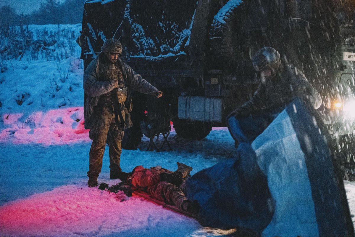 U.S. and multinational medical Soldiers evacuate a simulated casualty in snowy conditions during the 2023 European Best Medic Competition at Grafenwoehr, Germany recently.