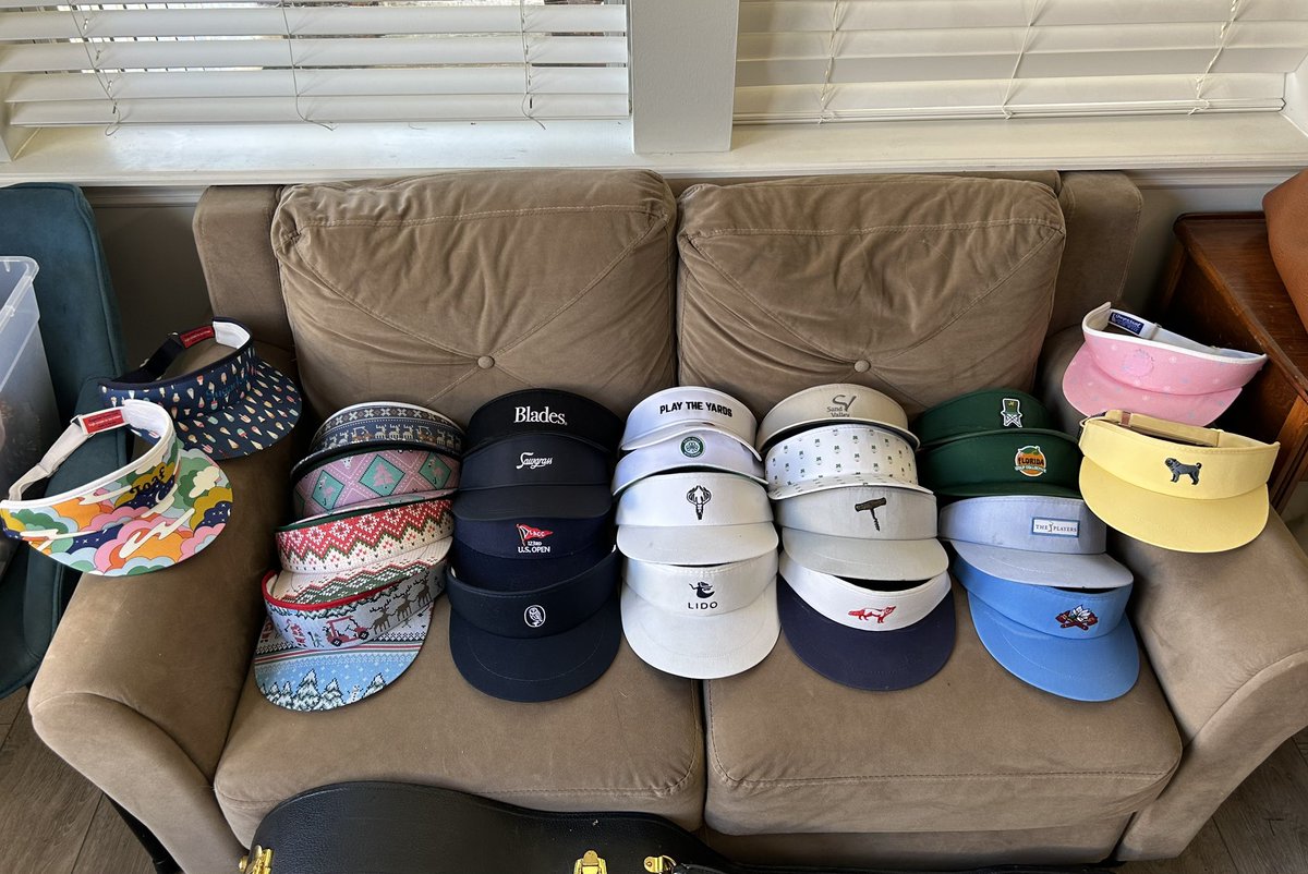 tweeth_mitchell's tweet photo. Unhinged? I'll show you unhinged. Here's every visor I got this year. Thanks to the #visorgang bros who made a few of these happen (@laz_versalles, @rkriggs14, @dblbogey4life, @lukeboat). Everyone pick their fave in the comments, maybe I'll wear the winner tomorrow. #viseup https://t.co/HyWlsHRvzH