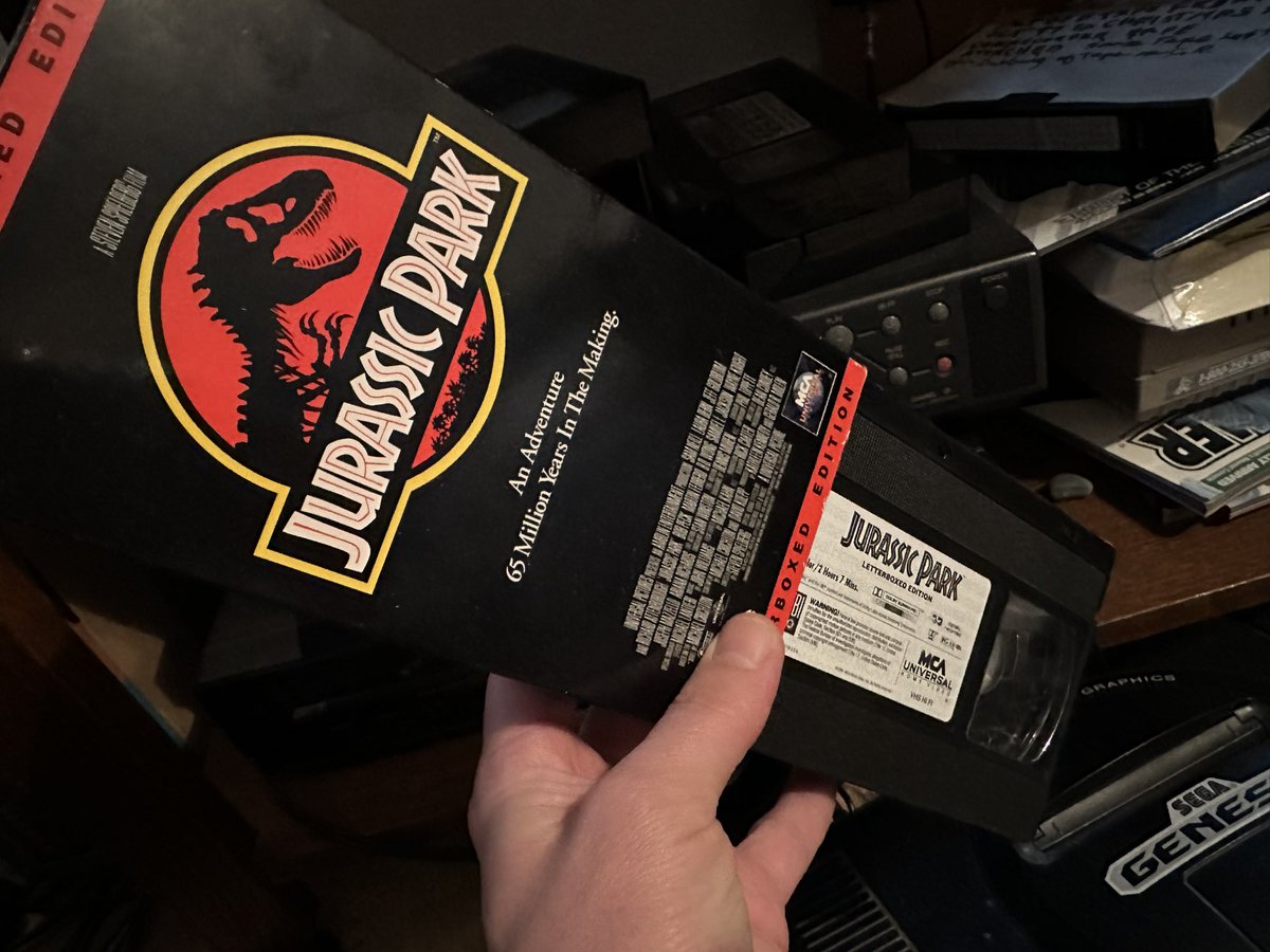 bearmccreary's tweet photo. My 9yo daughter: “What’s this huge thing?”

Me: “That’s a VHS cassette.”

9yo: “Whooooooa! So this is how you watched Jurassic Park? Did it still have the dinosaurs in it?”

Me: 😑 https://t.co/rzdhZiuybO