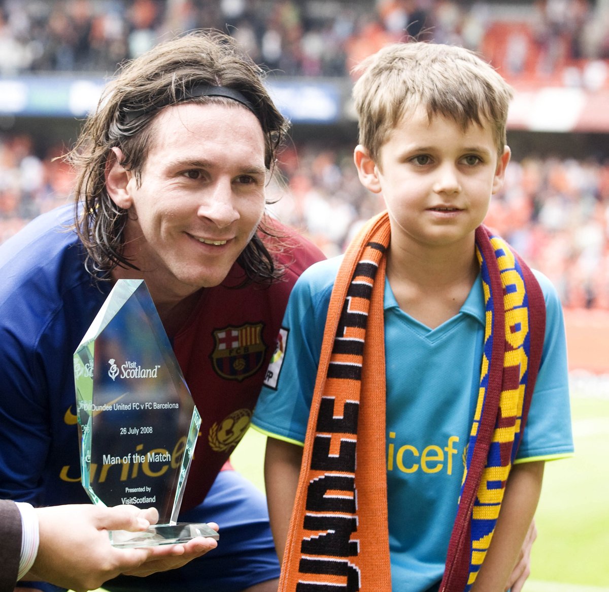 heraldscotland's tweet photo. Lionel Messi with a young fan at Tannadice after scoring a hat-trick for Barcelona against Dundee United, July 2008. 

Messi received the Man of the Match award for his performance in a 5-1 win, which also featured the likes of Gerard Piqué, Thierry Henry and Willo Flood. https://t.co/bbG5jWNFAy