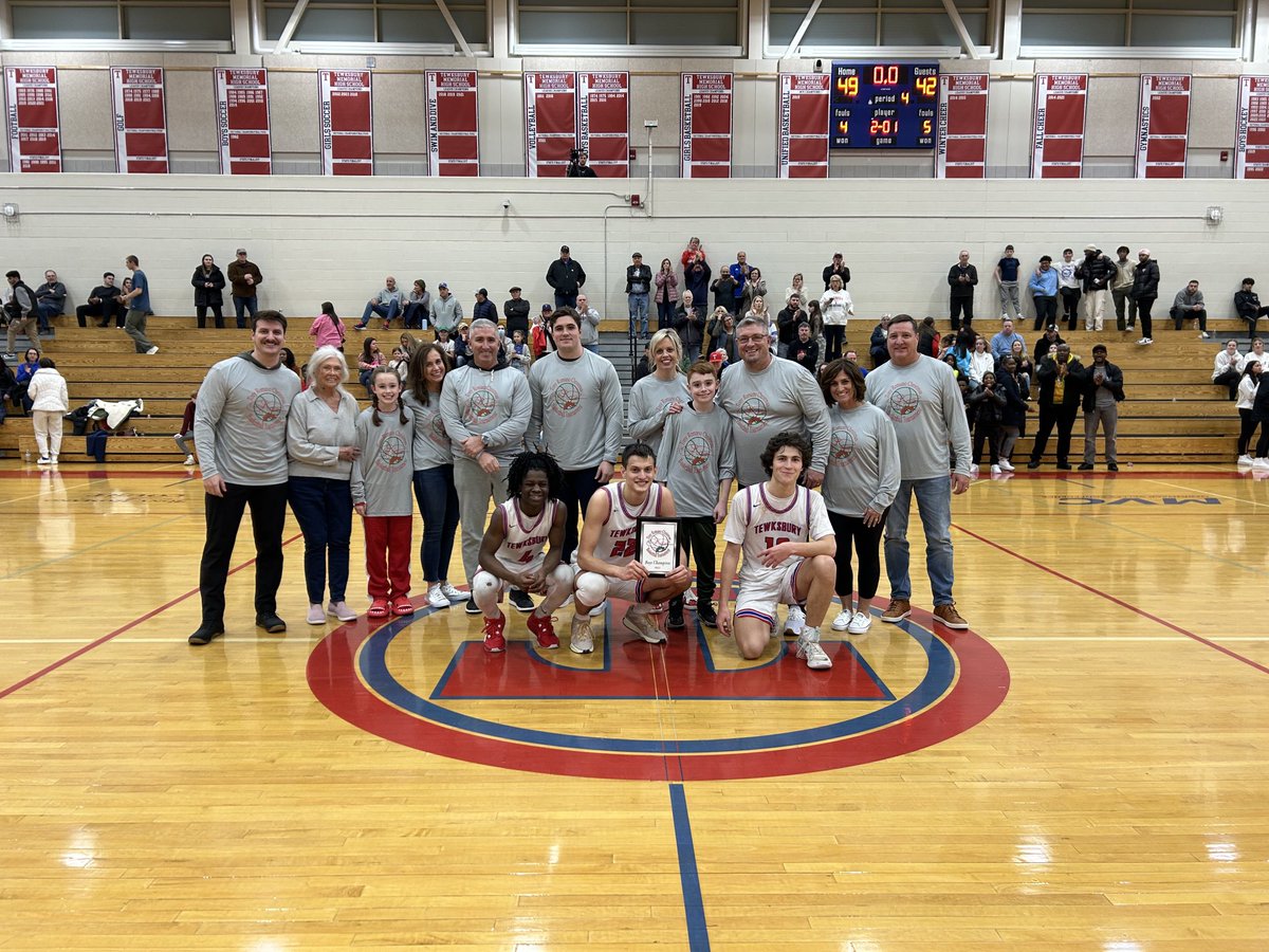 Redmen Captains with the Romano Family receiving their Championship Plaque