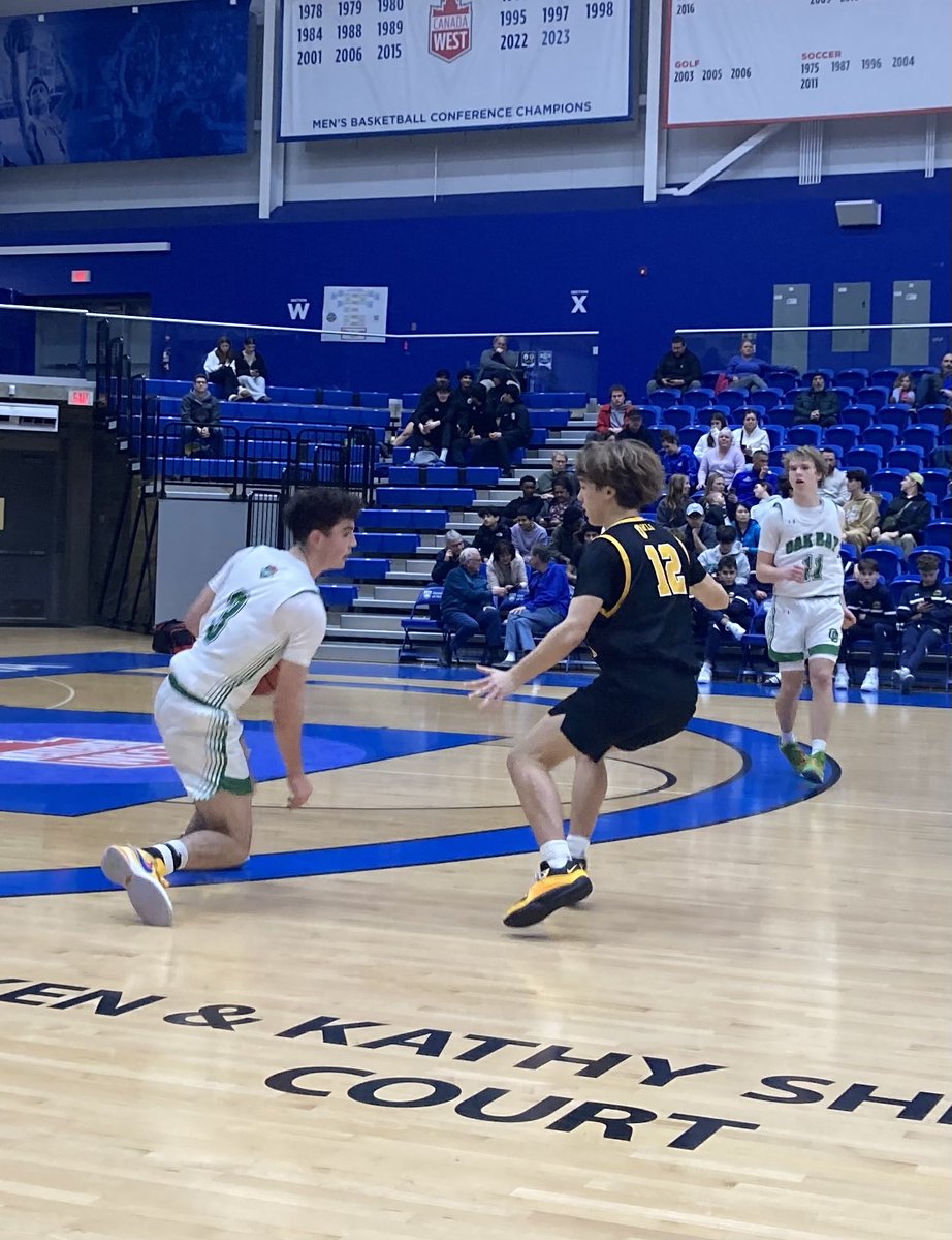 Thomas Beames of Oak Bay dribbles against Kelowna’s Logan Parker during the Bays’ 75-61 win over Kelowna in a semifinal of the UVic Vikes Alumni Invitational senior boys’ tournament on Friday. Oak Bay will meet Spectrum in Saturday’s final at 6 pm at CARSA.