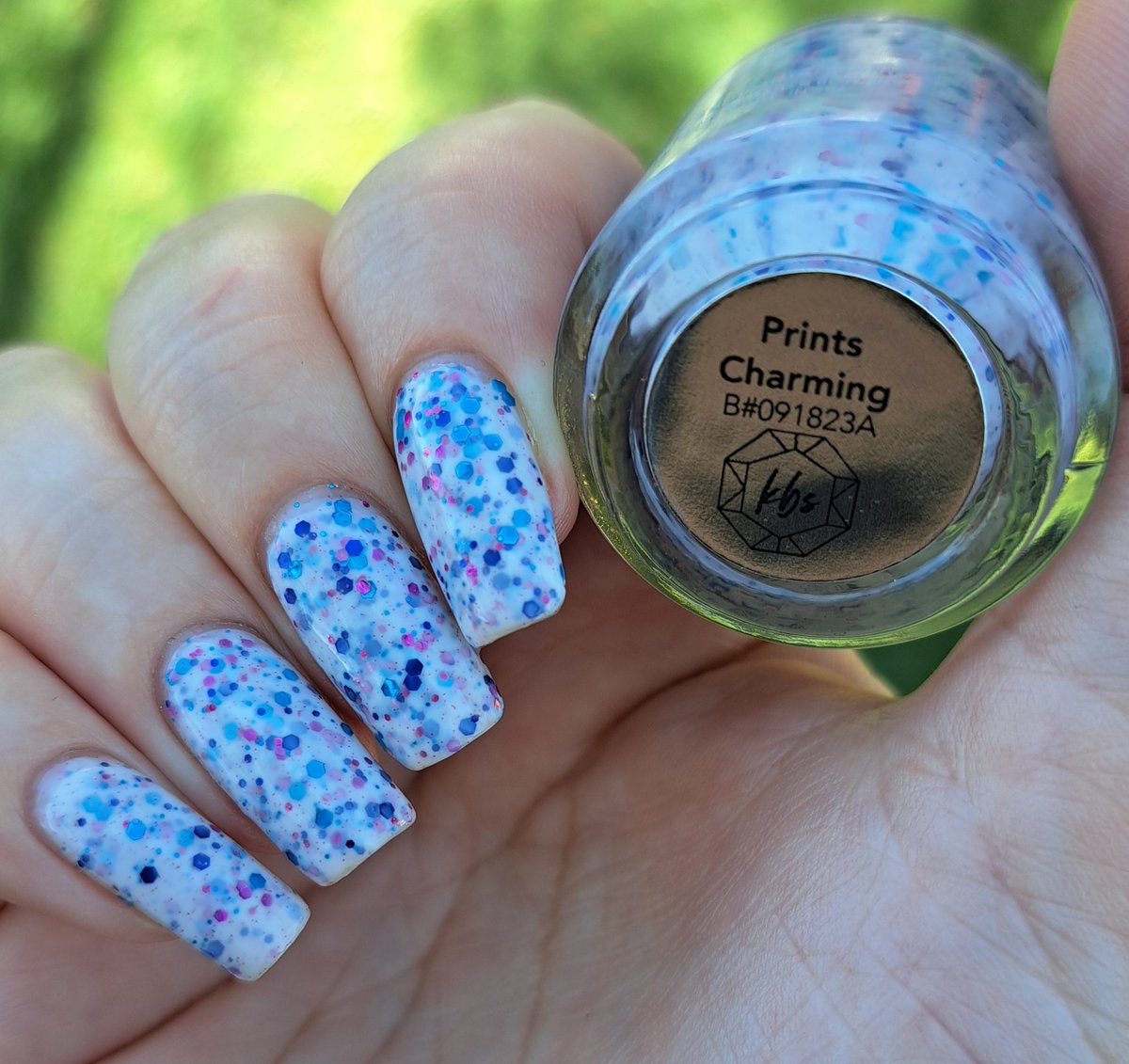 givemesparkles's tweet photo. This week's polish: 'Prints Charming' from @kbshimmer is a white crelly polish that is loaded with various sized fuchsia, turquoise and sapphire hex glitters, plus a scattered matching mirco glitters throughout. Crelly Love! 🫶😍✨️💅 #kbshimmer #indienailpolish #givemesparkles https://t.co/oNWnX019mY