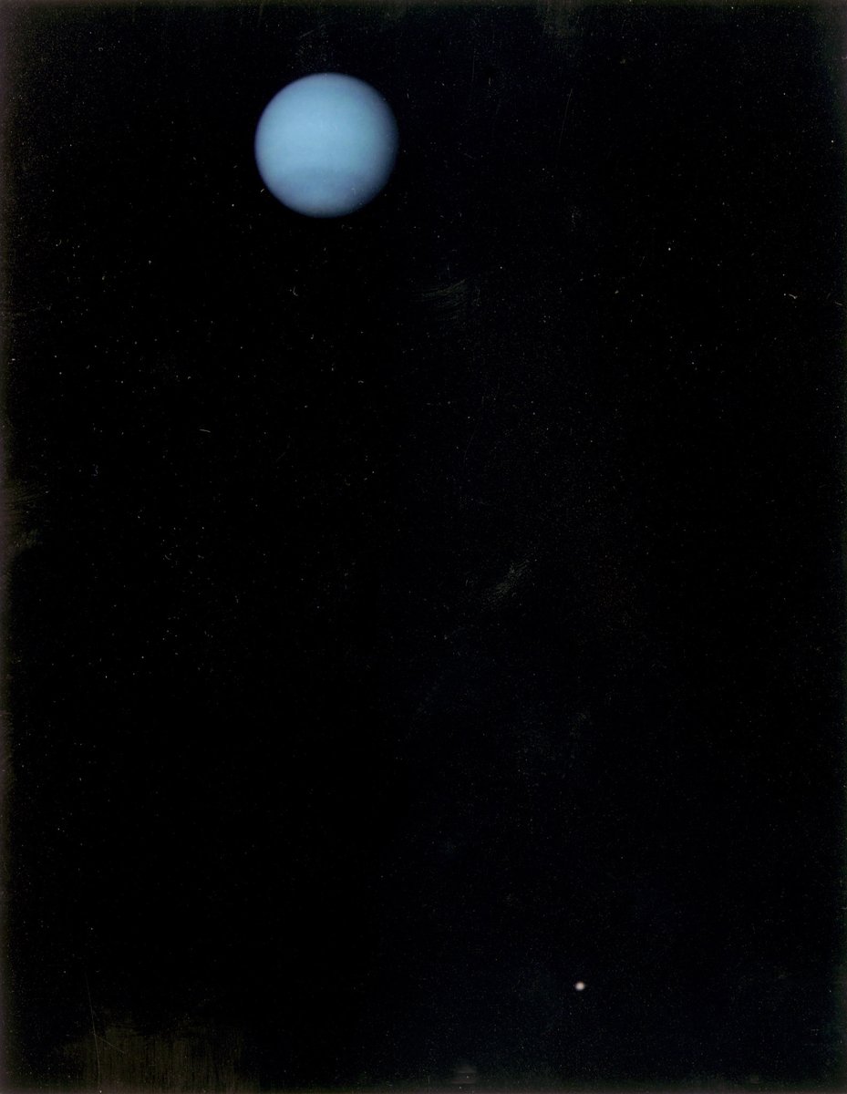 Neptune and Triton... This image was returned by the Voyager 2 spacecraft on July 3, 1989, when it was 76 million kilometers (47 million miles) from Neptune (Credit: NASA)