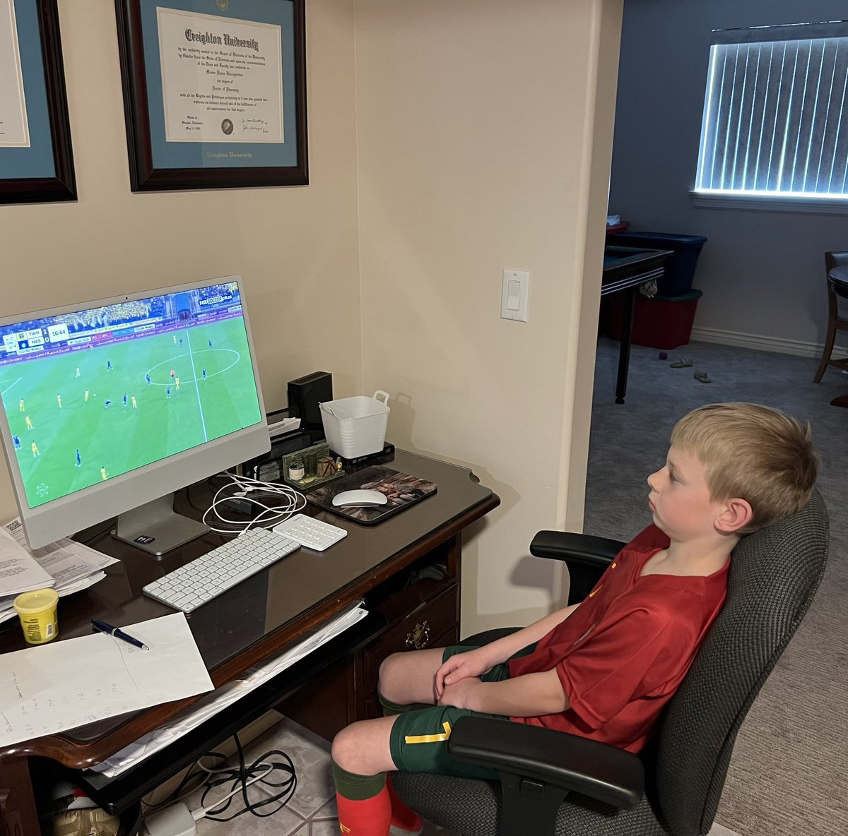 k_r_baum's tweet image. This boy has become obsessed with @cristiano so we found the game today and he’s wearing his new Ronaldo jersey while cheering him on.