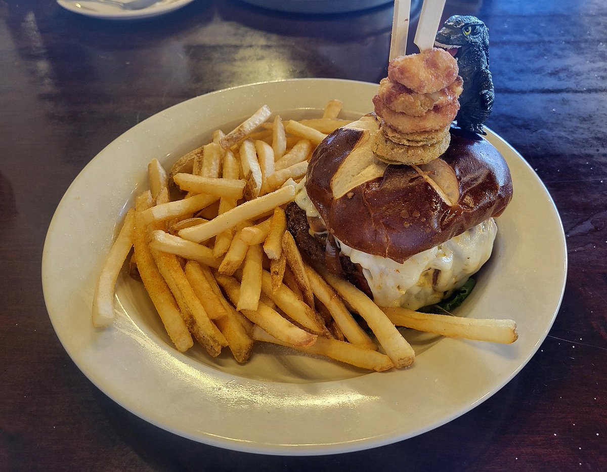 There is something in my food  #Meatzilla vs the aptly named Monster Burger.  #cheesecurds #friedpickles #beef #cheese #onion #egg #pretzelbun #fries #delicious #tasty #itsfortwo #carnivore
