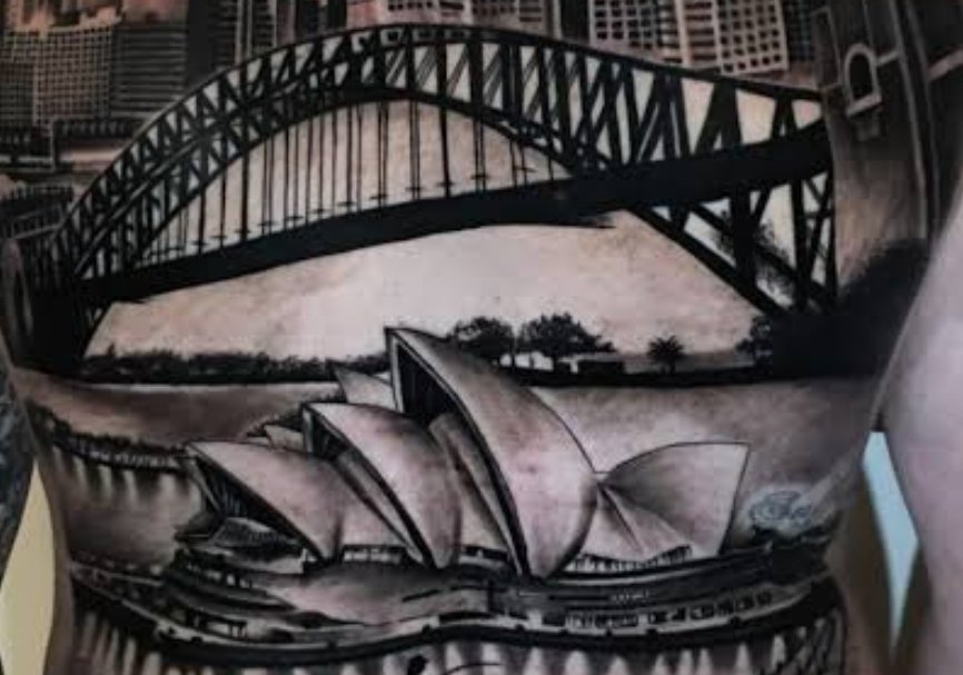 NSW tattoo now to workout what side of the bridge to add <a href="/chloemollloy/">Chloe Molloy</a> kicking the ball to a GWS player on other side bridge.