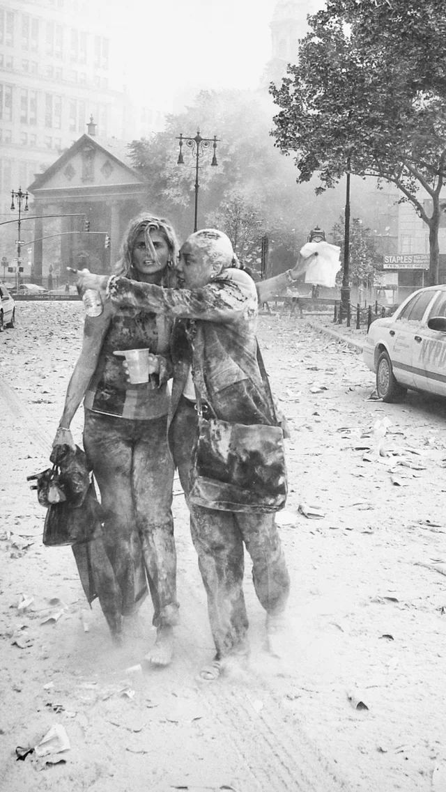 Survivors from the 87th Floor of the World Trade Center (North Tower) Wandering in the Dust after the Collapse of the South Tower - New York City, September 11, 2001