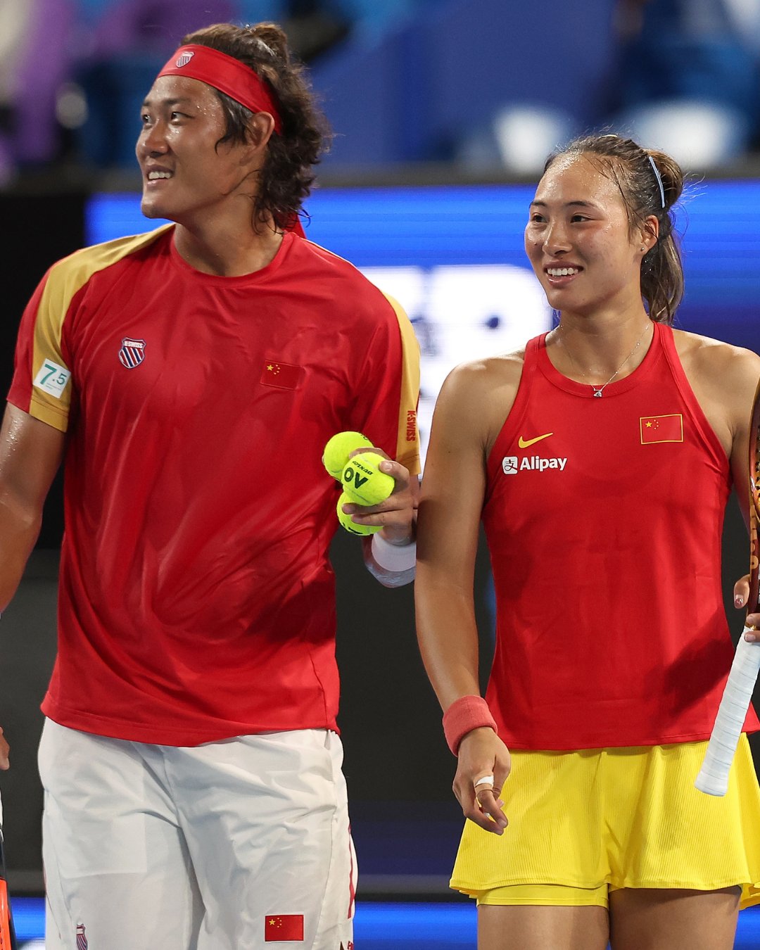 Zhang Zhizhen and Qinwen Zheng of Team China talk during the mixed doubles match against Novak Djokovic and Olga Danilovic of Team Serbia during day three of the 2024 United Cup at RAC Arena on December 31, 2023 in Perth, Australia. 