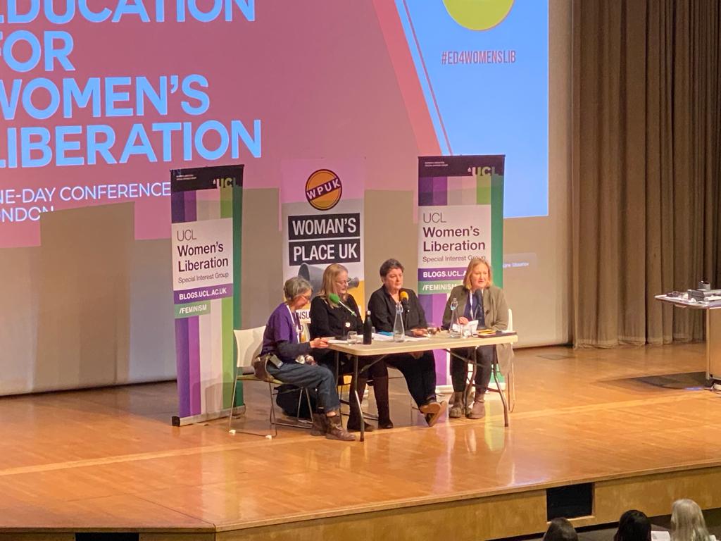 Four women speaking at the panel plenary session at UCL women's liberation conference.