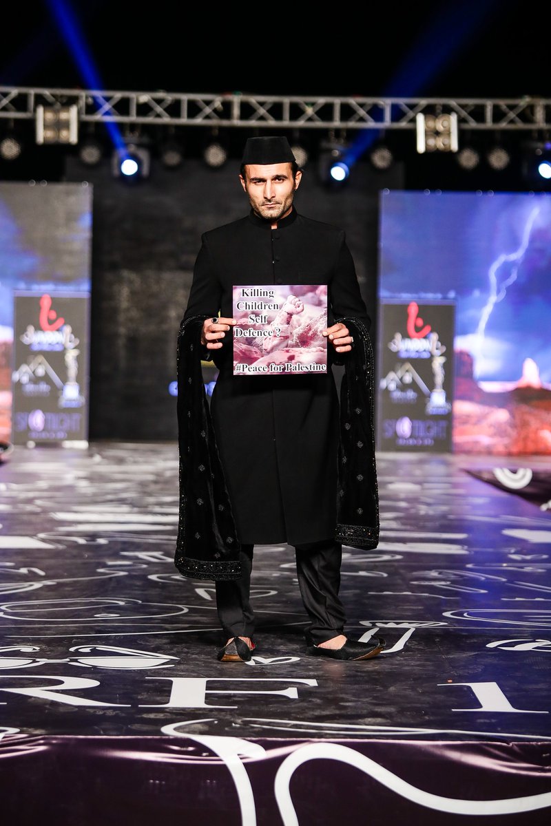 Fuzaan_Khan's tweet photo. For The Children of Palestine 
SRF14
SRFPAKISTAN
Style Runway Fashion Show Pakistan Season 14
Organized by Zia Zafar 
&amp; what did u see, my darling young one? 
"I saw bleeding children drowning in a coma because heavy stones fell on their fragile heads."
Model : Fuzaan Khan https://t.co/WOVOk3hcR2
