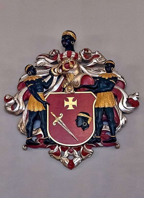 Look at this magnificent wooden altar piece that I found in Riga, Latvia in December 2015!  Latvia is in far northern Europe on the Baltic Sea.  At the bottom of the altarpiece on the shield is the Black Saint Maurice.  And look at the images of the Black men above and on the