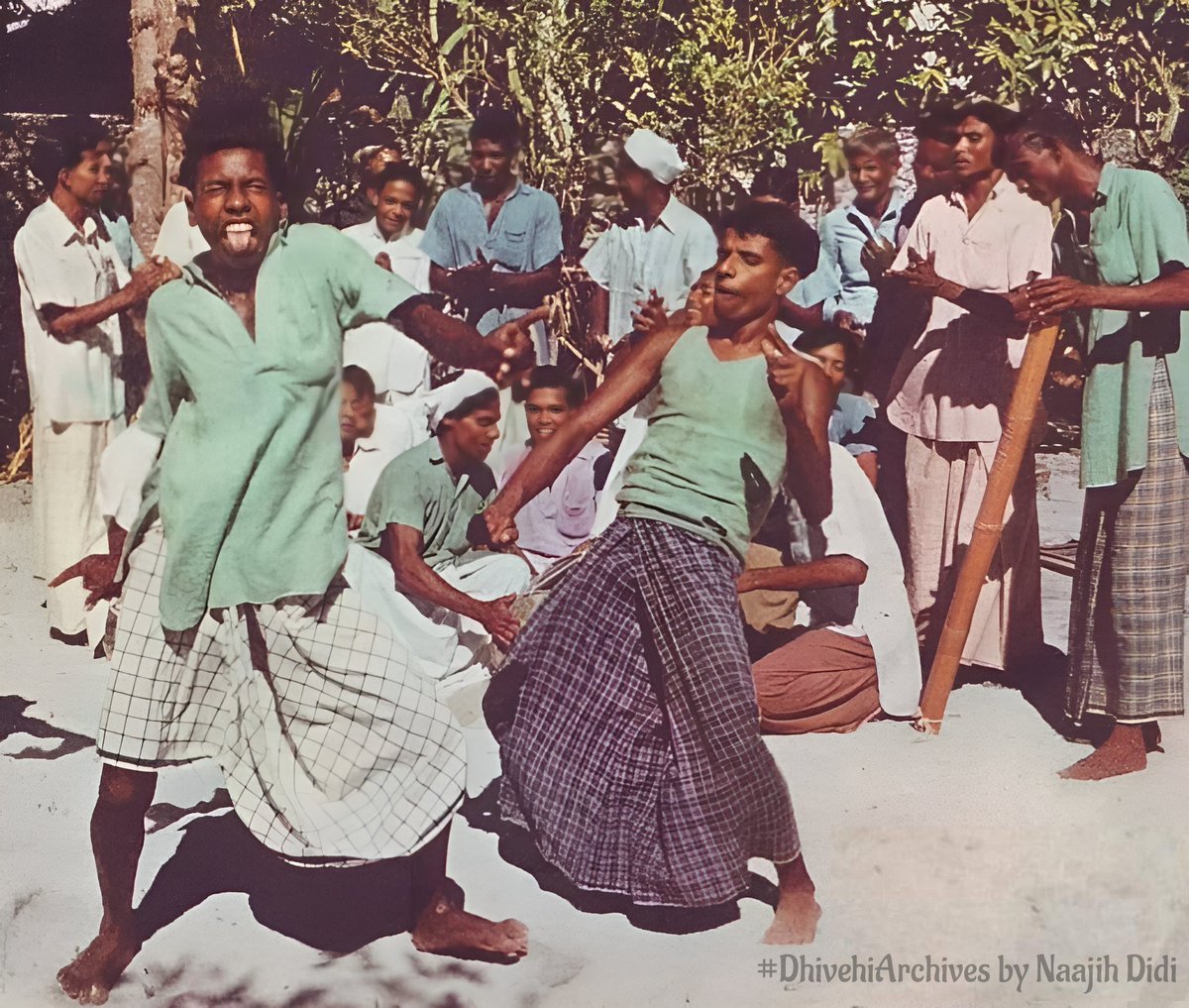 #DhivehiArchives
Grimacing dancers do a speciality number.Full of laughter &amp; contentment, untouched by sophistication, Maldivians lead happy carefree lives. Comic faces are an essential part of this performance. 

📷 Allan Villiers, The Marvelous Maldive Islands, 1957, Nat Geo