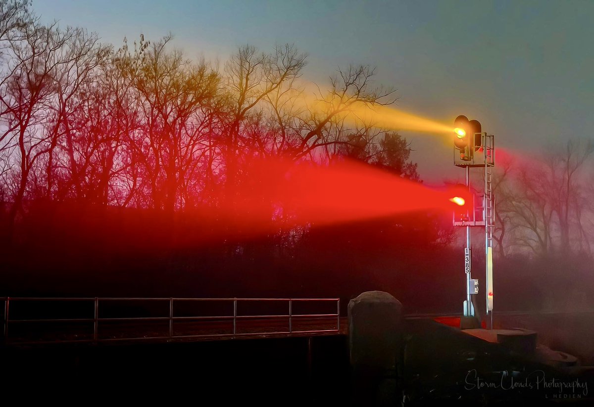An #iphone 📱image of #railroad signal light 🔦 in the #fog. 🛤️ #eerie #red #yellow #bridge #moody #railroadtracks #Lakecounty #illinois #photography #thephotohour #natgeophotos #natgeoyourshot #hey_ihadtosnapthat_ @riyets @discovery