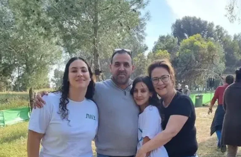 Eli Sharabi with his wife Lianne, and daughters Noya, 16, and Yahel, 13. On Oct. 7, the family was in their home in Kibbutz Be’eri. The last message Lianne sent her family was: 'The terrorists are at our house.' After breaking into the house, terrorists shot and injured first…