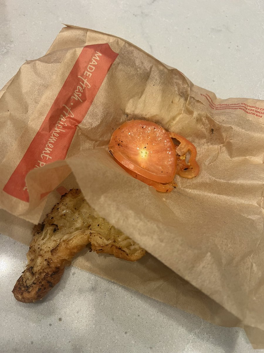 ladaannn's tweet photo. tell me why i ordered a plain butter croissant from @TimHortons and had to pick multiple tomatoes out of it?? 

also why does my croissant look like that😭

lost my appetite over this https://t.co/tF7vW6f4lG