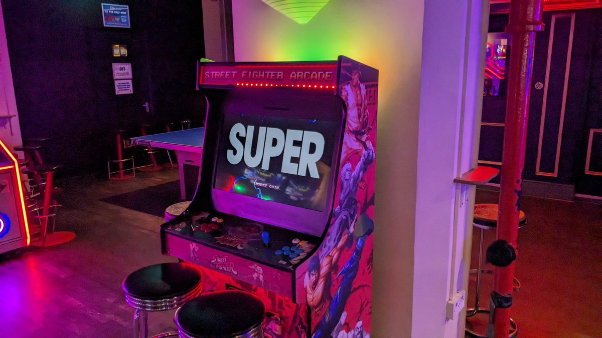 PixelCNinja's tweet photo. The kids wanted to play Air Hockey, so I took them to #Rowans in #FinsburyPark. It was where I used to hangout as a kid myself. Even though it's not the same as it was back then, some of the modern shooters and racers are a lot of fun. SF cabinet was crap though 😂 https://t.co/5ztmaIPGpR