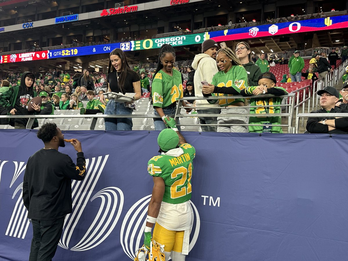 Oregon DB and Basha alum @colemartin21 visiting with family during warmups for the Fiesta Bowl