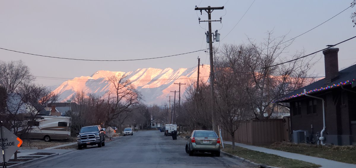 A block from our house. The sunset lit up the mountains for a brief moment. I'm glad we turned around to catch it.