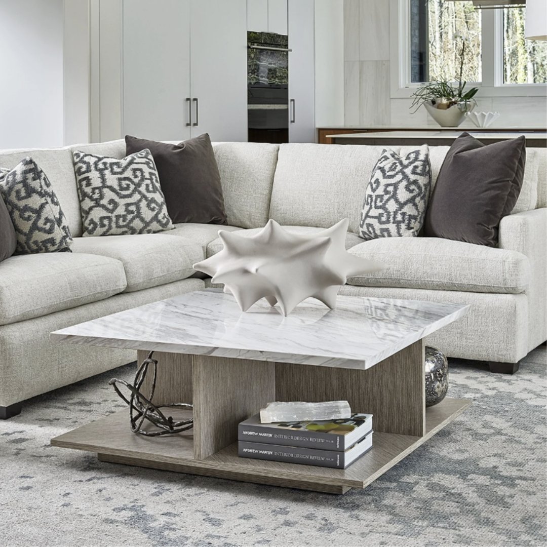 The Whitley Cocktail Table with its floating base and lower cubbies doubles as a centerpiece display for your favorite decorative accents and figurines.

#interiordesign #livingroominspo #neutrallivingroom #coffeetable #cokctailtable #homedecor