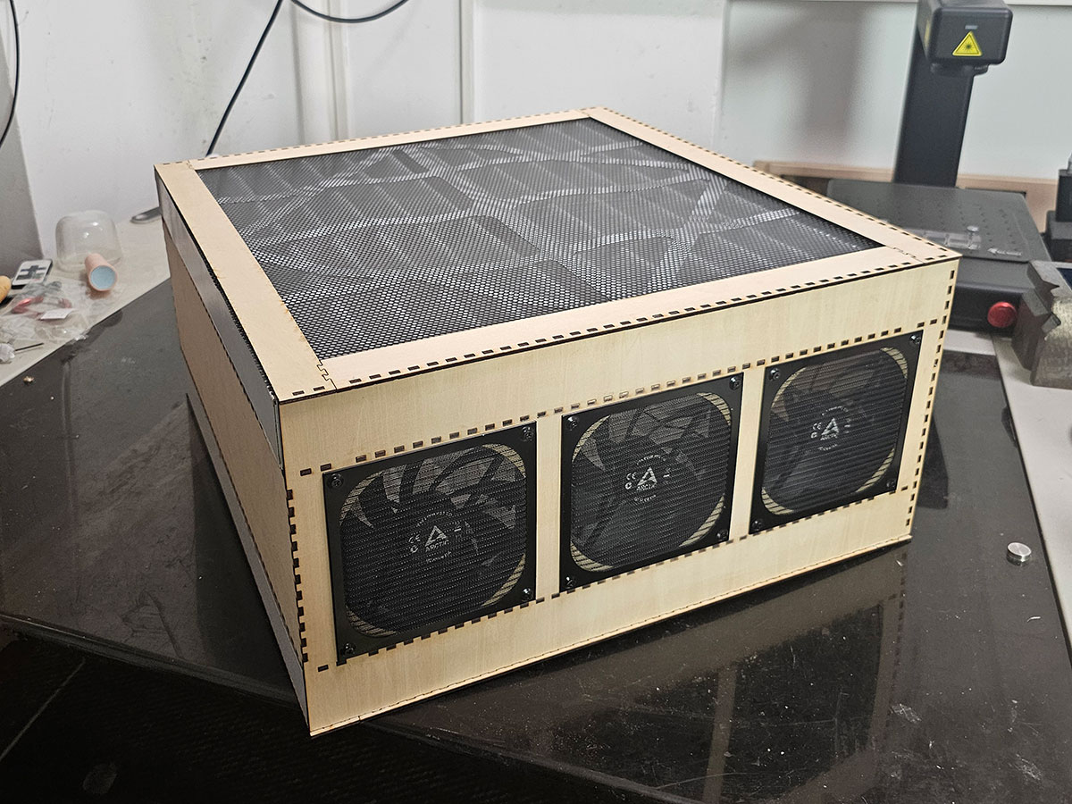 NukitToBeSure's tweet photo. First test assembly of the parametric version of the Nukit Open Air Purifier. This is generated by a web app so you just select how many fans, what size, what sides of the box they are on, how many filters, what size, and it automatically generates the files for the lasercutter. Then just fit and glue.
 
This is a horizontal version designed to be hung from a ceiling. Could use a coat of paint, but otherwise not bad🤔 Any school with a 6040 lasercutter and some wood glue can whip them up on the cheap.