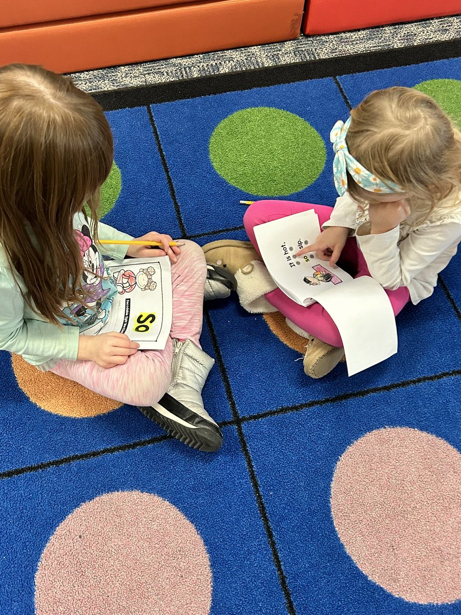 Practicing our Red Word books with a partner.