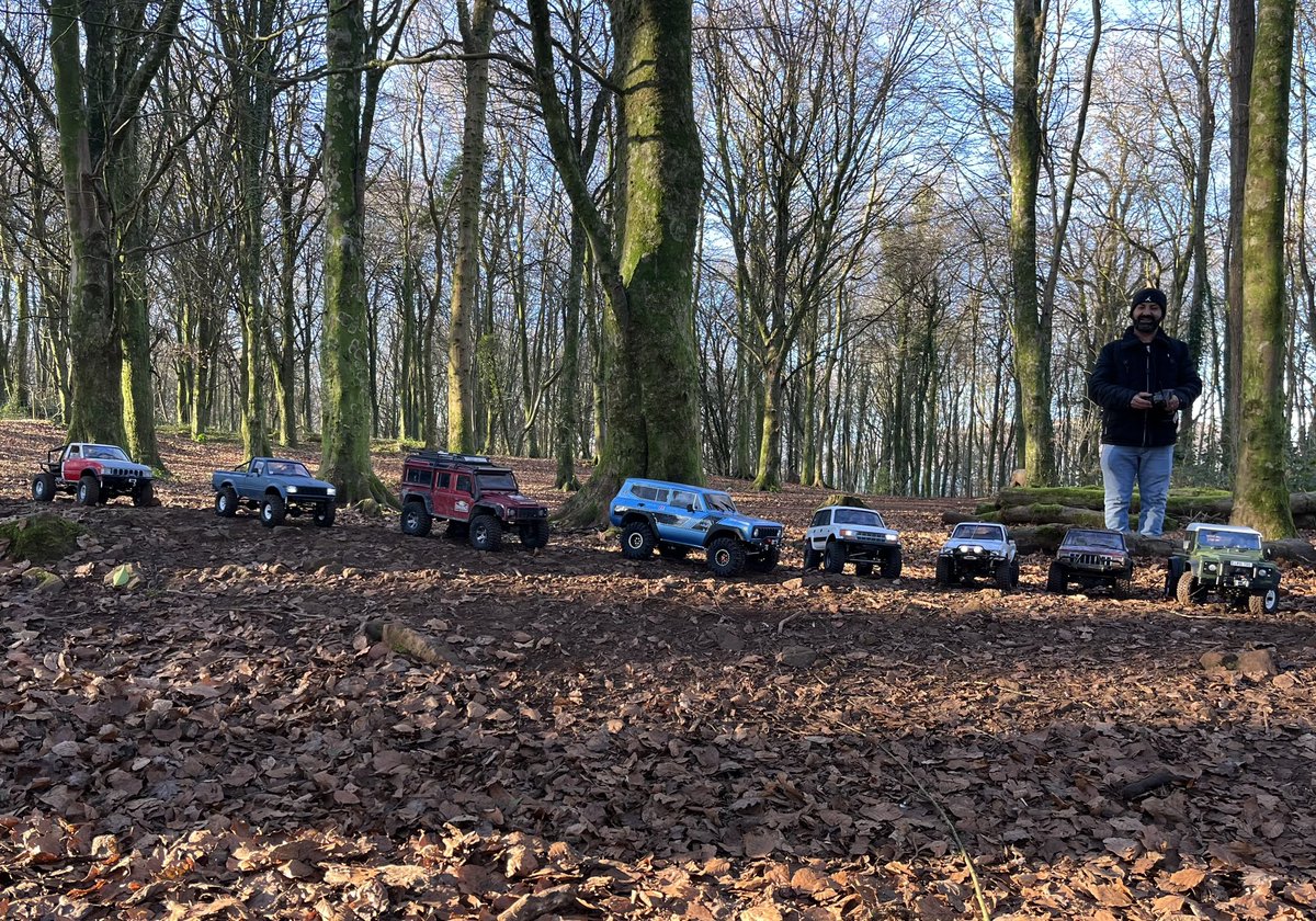 AWeltch's tweet photo. A pleasantly unexpected bonus on this morning’s trail run: we came across a bunch of guys driving 1/10-scale off-roaders through the woods. They kindly lined them up for my pic! #rccars #offroadvehicles https://t.co/ntMfttQtNd