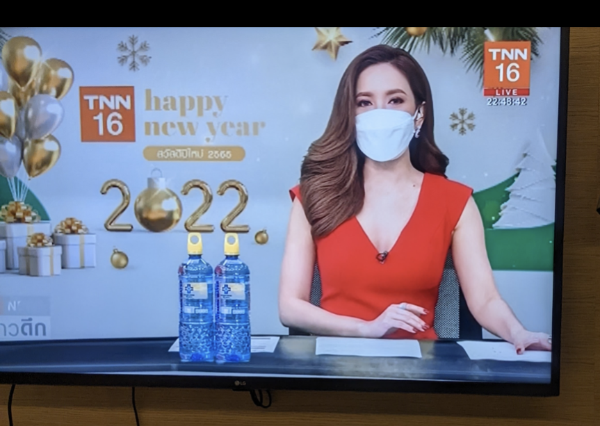 Thai newscaster wearing a respirator mask 