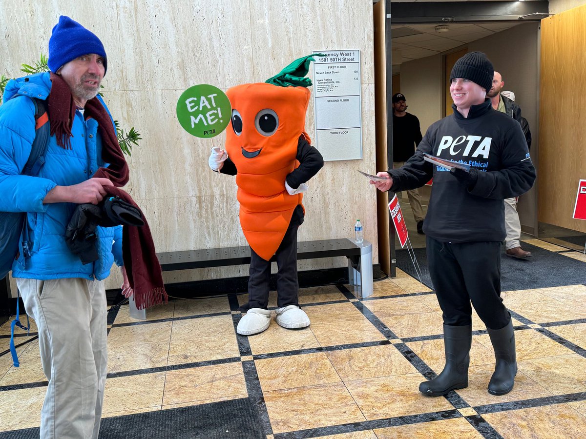 Chris P. Carrot at Iowa caucuses.  Other side says "Go vegan or we all die!"