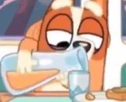 Bingo trying to find the perfect angle at which to pour her orange juice