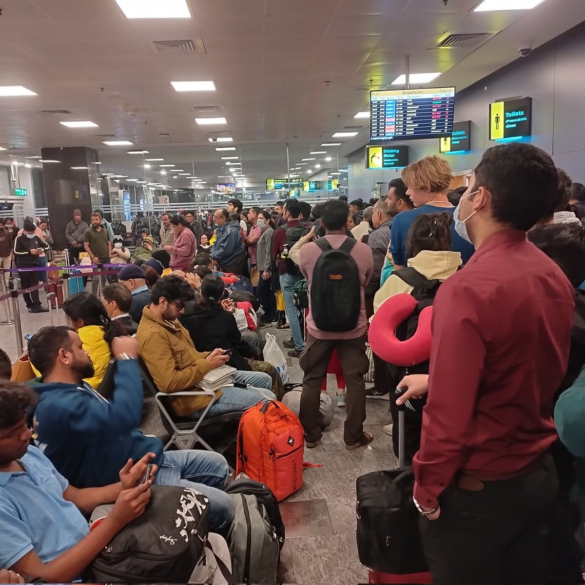 skgkartha's tweet photo. @IndiGo6E @BLRAirport  Is this the best airport in India has to offer to passengers waiting to board the top airline in India? Passengers of all ages waiting like they would at a city bus station https://t.co/F1Iz5cMDSV