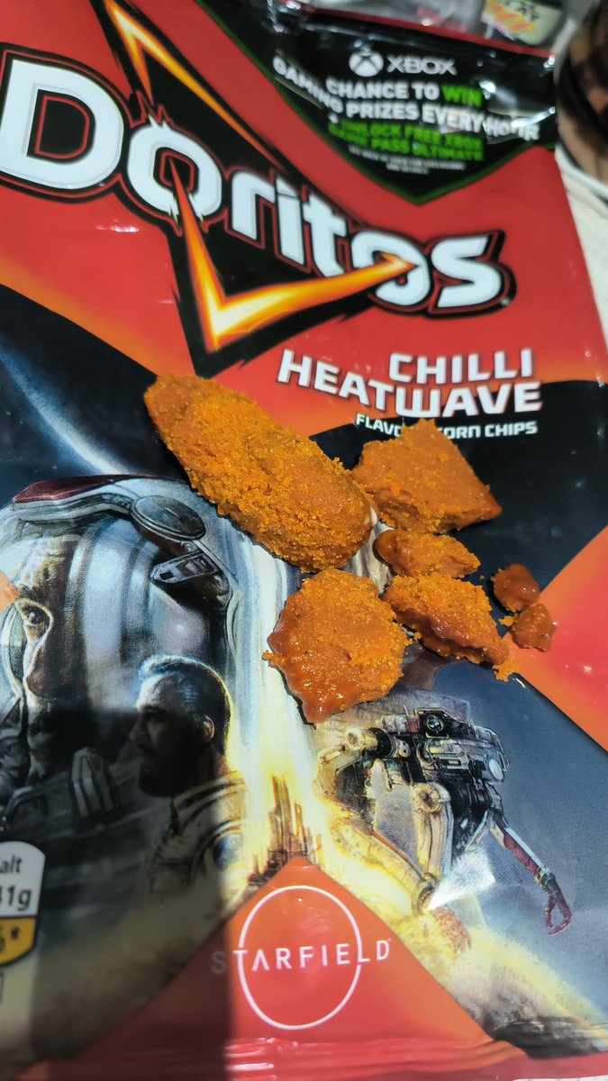 nicksergi's tweet photo. @DoritosUK have some explaining to do, counted a total 21 crisps in a big bag of chilli heatwave. Plus loads of this?! https://t.co/chKf6p70hL