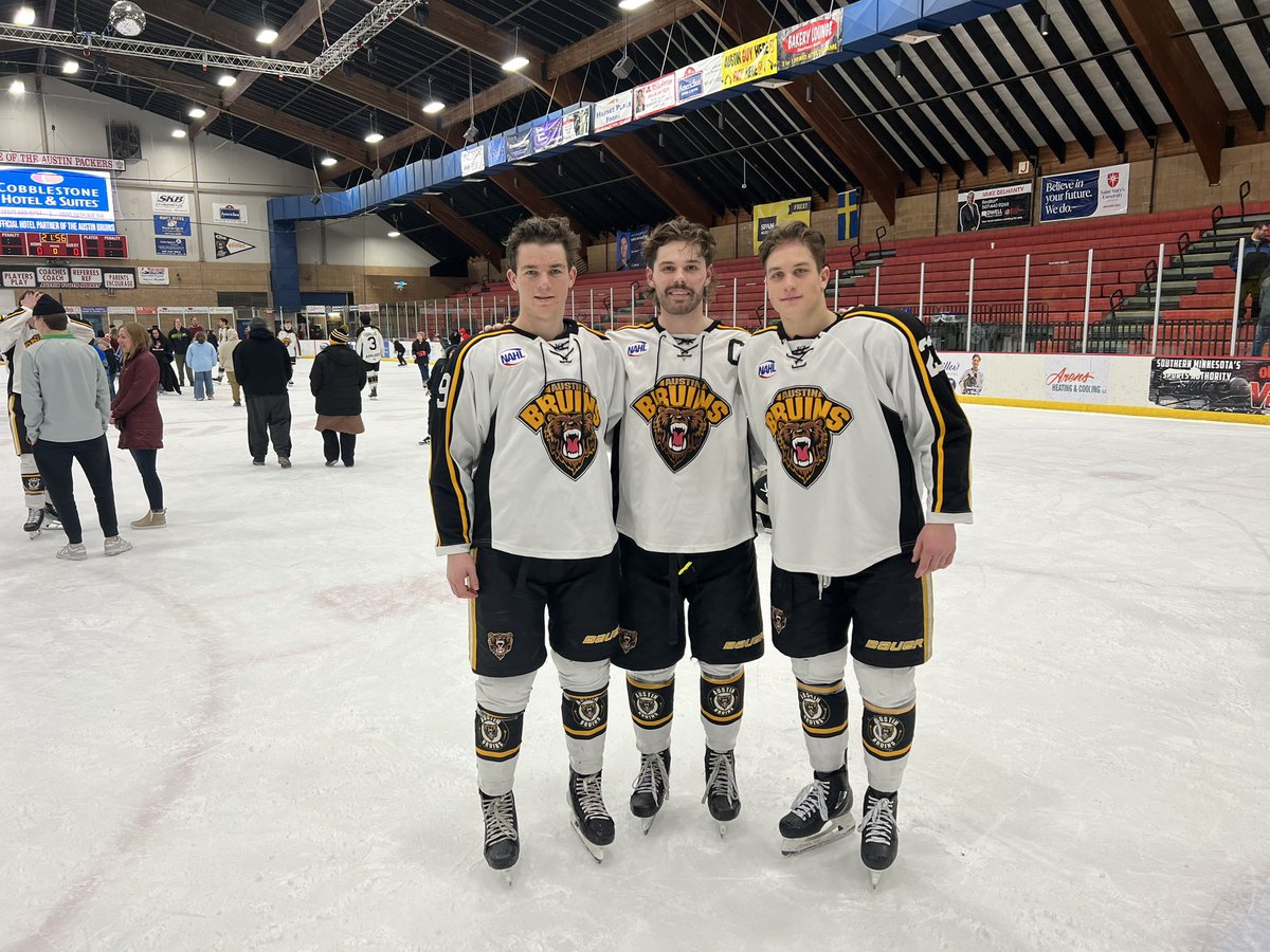 3 Copper Country  High School hockey players suiting up for the Austin Bruins. Very cool.