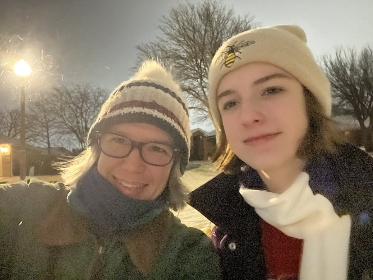 robynrdobbins's tweet photo. Nighttime walk in the snow with my girls. It probably won’t last long so we took advantage while we could. #DaisyRaven tries to eat it and walk at the same time. https://t.co/1DH3bmyy02