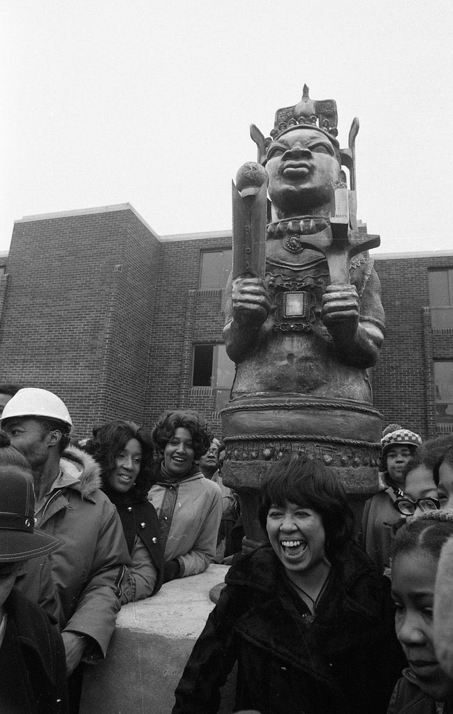 Sculptor Geraldine McCullough stands in front her sculpture of Martin Luther King at its unveiling ceremony outside Martin Luther King Jr. Plaza Apartments, 3220 W. Madison, 1/15/1973. Chicago Sun-Times photo collection at the Chicago History Museum. Photographer not listed.