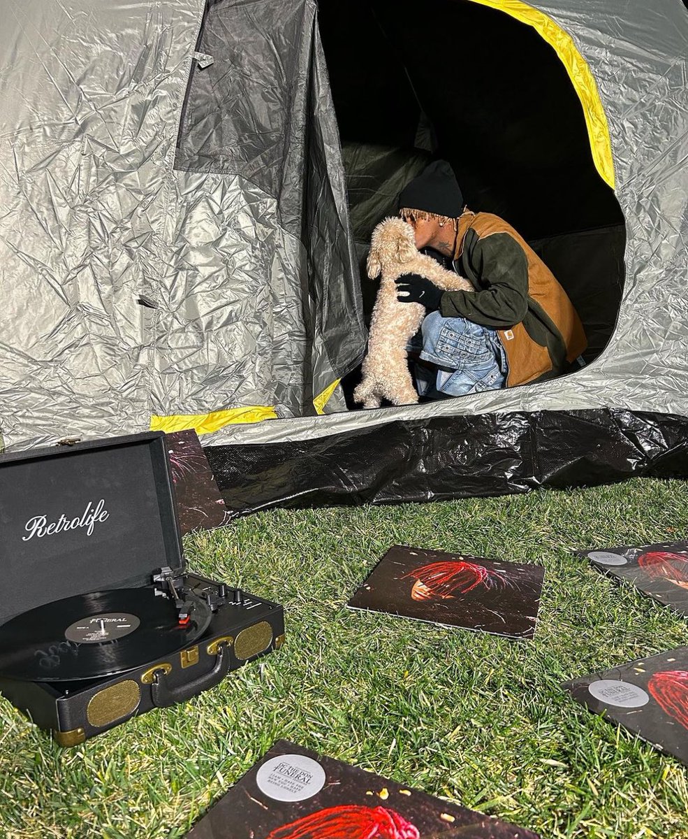 ExplainingDc's tweet image. dc the don with funeral vinyls and a dog