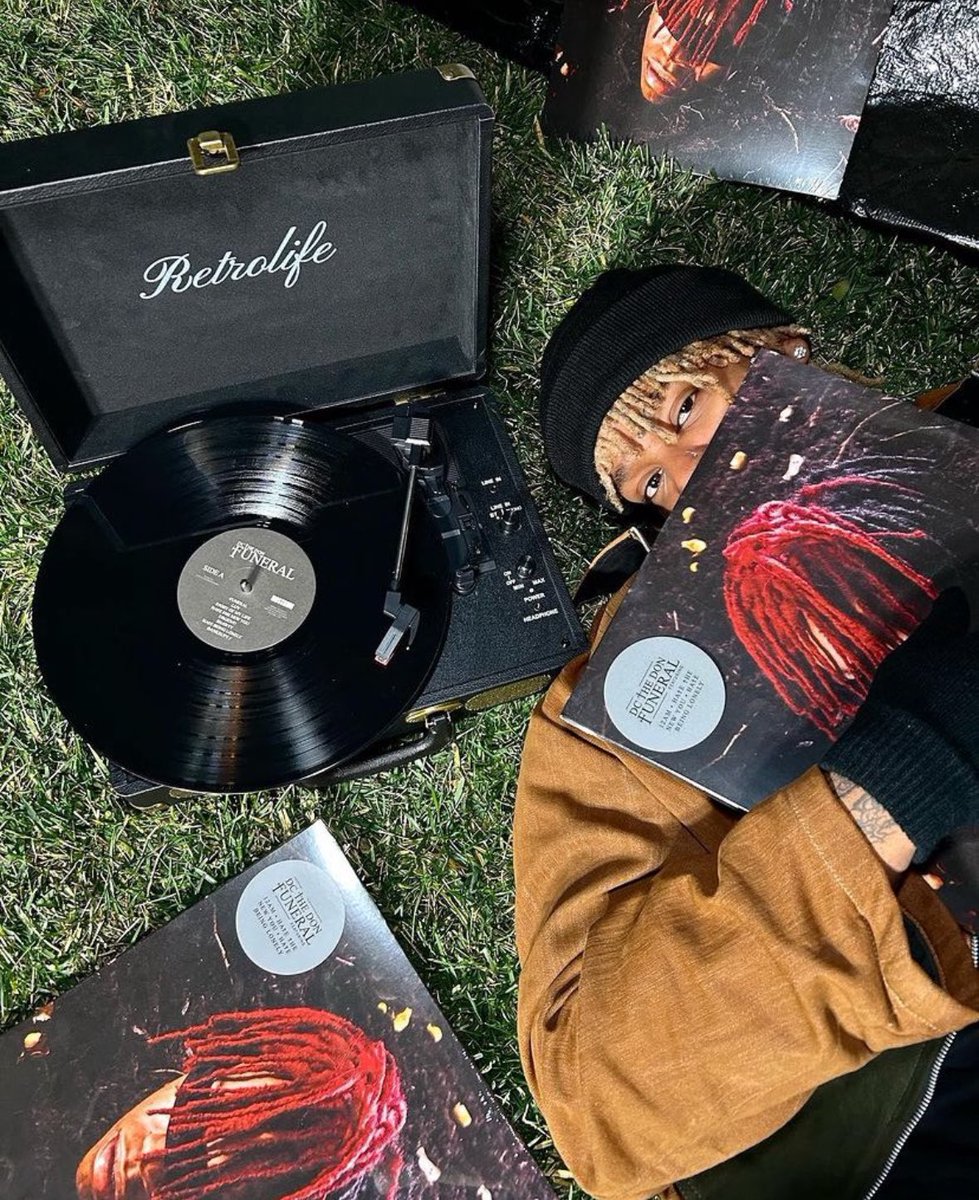 ExplainingDc's tweet image. dc the don with funeral vinyls and a dog