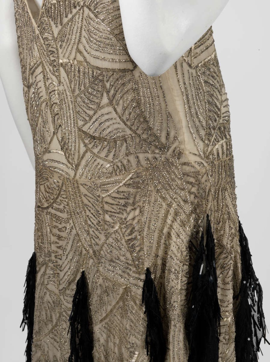 LaurenCDeutsch's tweet photo. #Ootd is this 1926 evening dress by A &amp; L Tirocchi. It's made of silk embroidered with bugle beads and sequins. The gold and black contrast nicely to make a dramatic statement at the bottom of the gown. I would love to see it swoosh on the dance floor @RISDMuseum #fashionhistory https://t.co/o06fHYjdqn