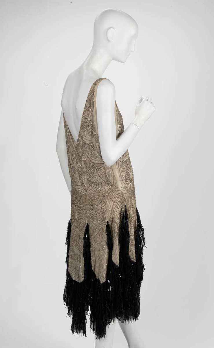 LaurenCDeutsch's tweet photo. #Ootd is this 1926 evening dress by A &amp; L Tirocchi. It's made of silk embroidered with bugle beads and sequins. The gold and black contrast nicely to make a dramatic statement at the bottom of the gown. I would love to see it swoosh on the dance floor @RISDMuseum #fashionhistory https://t.co/o06fHYjdqn
