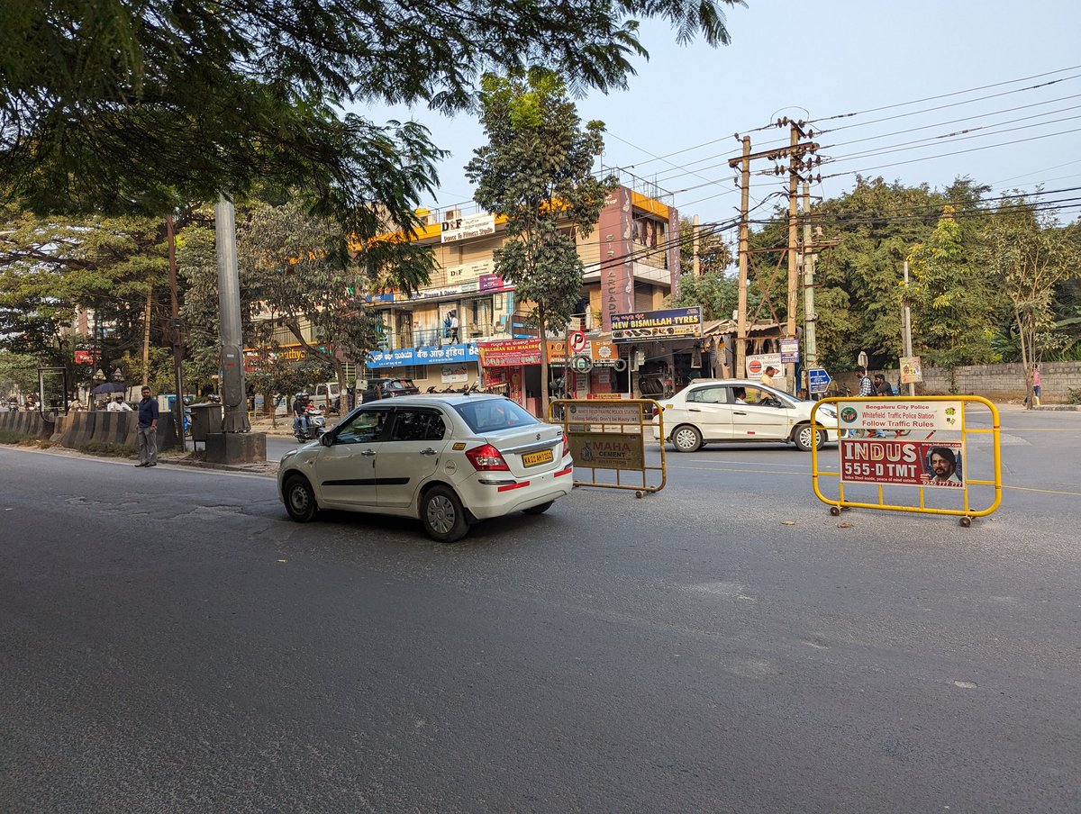 iamnosomeone's tweet photo. @blrcitytraffic @acpwfieldtrf This turning on Whitefield Main Road opp Brigade Cosmopolis has been closed. This also closed pedestrians crossing the road. More than 100+ kids cross this road every morning to catch their school bus. Please do not stop people from crossing. https://t.co/cCLTjlQzhu