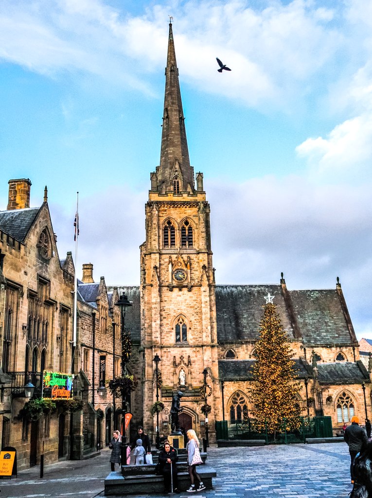 pewileman's tweet photo. Dove rising above St. Nics Church, people resting in #Duham market place. @NorthEastTweets https://t.co/1sUHqEucvI
