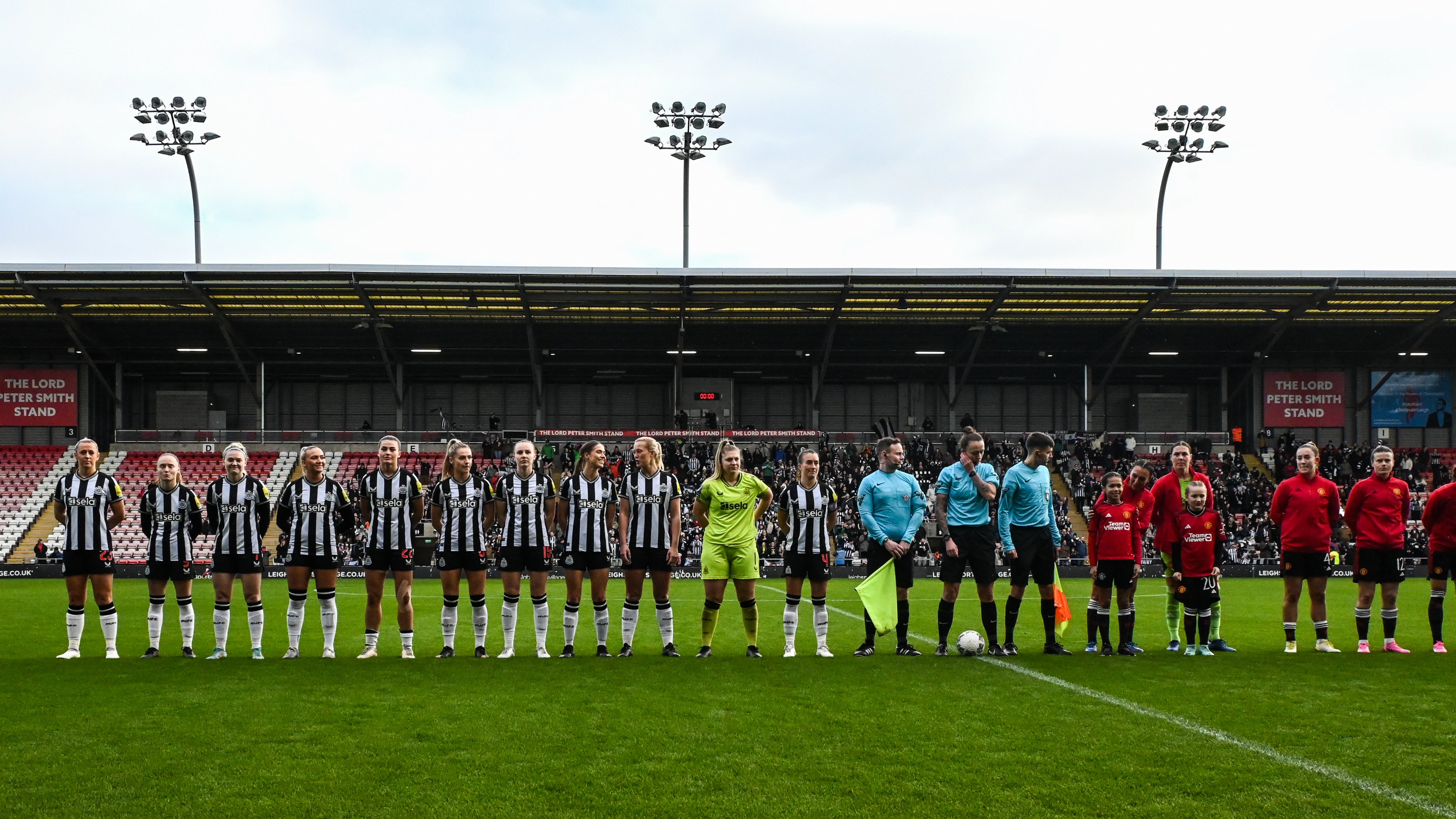 Newcastle United Women and Manchester United Women line up at Leigh Sports Village.