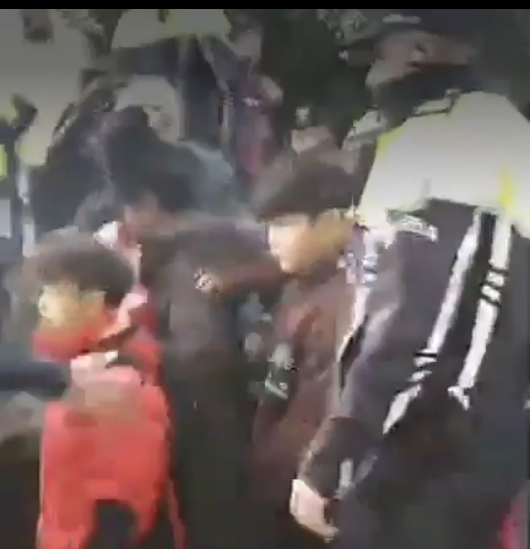 TullMcAdoo's tweet image. Some stills from the videos, the far right are disseminating online from Roscrea. These are women with their children clinging to them in palable fear, being protected by the Gardai from a baying mob. 
You can call it what you want, but it's very fascist behaviour.