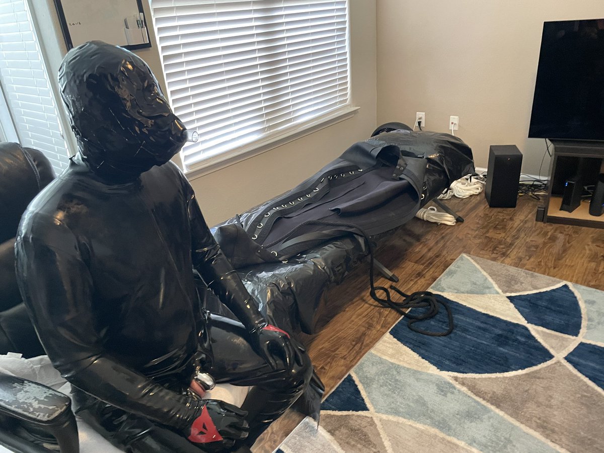 gluvlover's tweet photo. After an incredible 6 hours mummified in duct tape, it was my turn to put @justdifferenttx in bondage. After putting him in two layers of rubber, I duct taped an anesthesia mask to his head and put him in a sleepsack. He was in there for 24 hours! https://t.co/va6MJkBcnz