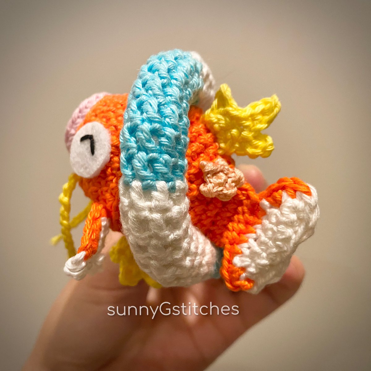 sunnyGstitches's tweet photo. the struggling magikarp on pokémon concierge struck a chord with me. i had to recreate him from yarn #magikarp #pokemonconcierge #amigurumiartist #crochetartist #crochetdesigner https://t.co/I9GquG3FeV