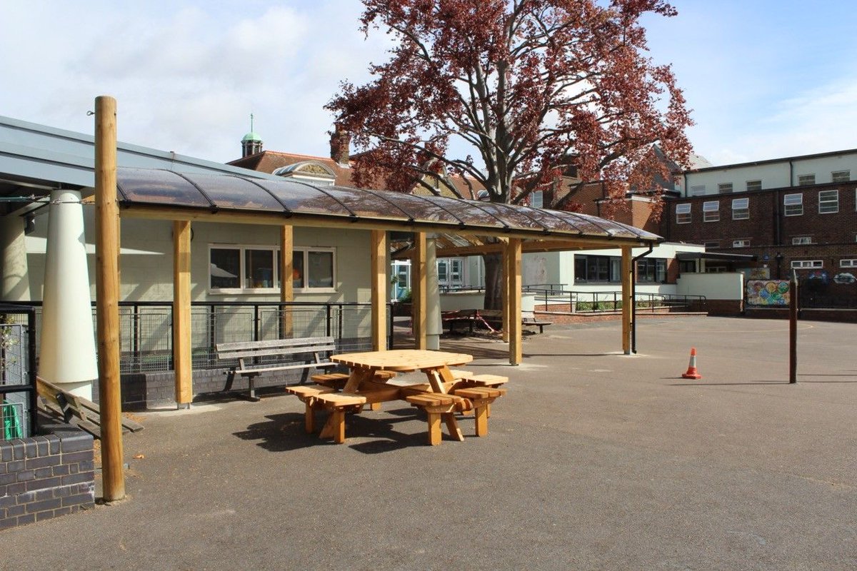 This #architectural curved beam #canopy was installed for @LancasterianPri in Tottenham! The panels above filter out 98% of harmful UV rays, while also helping to increase light flow beneath, making them the perfect unique and practical addition to any outdoor space. #shelter