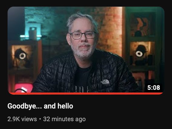 Screenshot of the YouTube thumbnail for my new video. It's of me sitting on my set, dressed in a dark jacket, cool and warm lighting clashing around me. YouTube logo bottom left. Rene Ritchie channel logo top right. Title is Goodbye... and hello