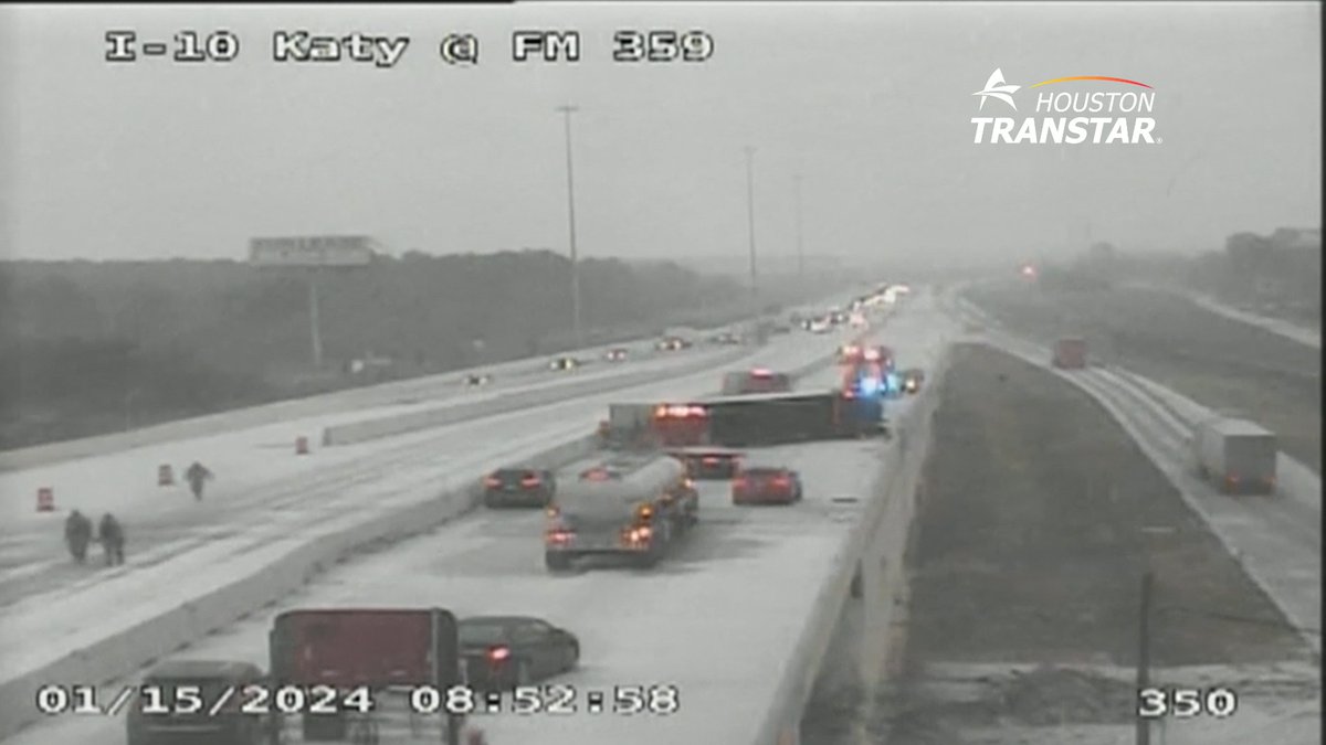 SNOW on Katy Freeway - Overturned 18 wheeler ... conditions for travel are deteriorating